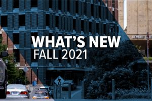 cars waiting to enter a parking deck, "whats new fall 2021" is written on the image