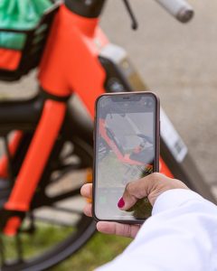 Woman using the Spin app to end a bike trip